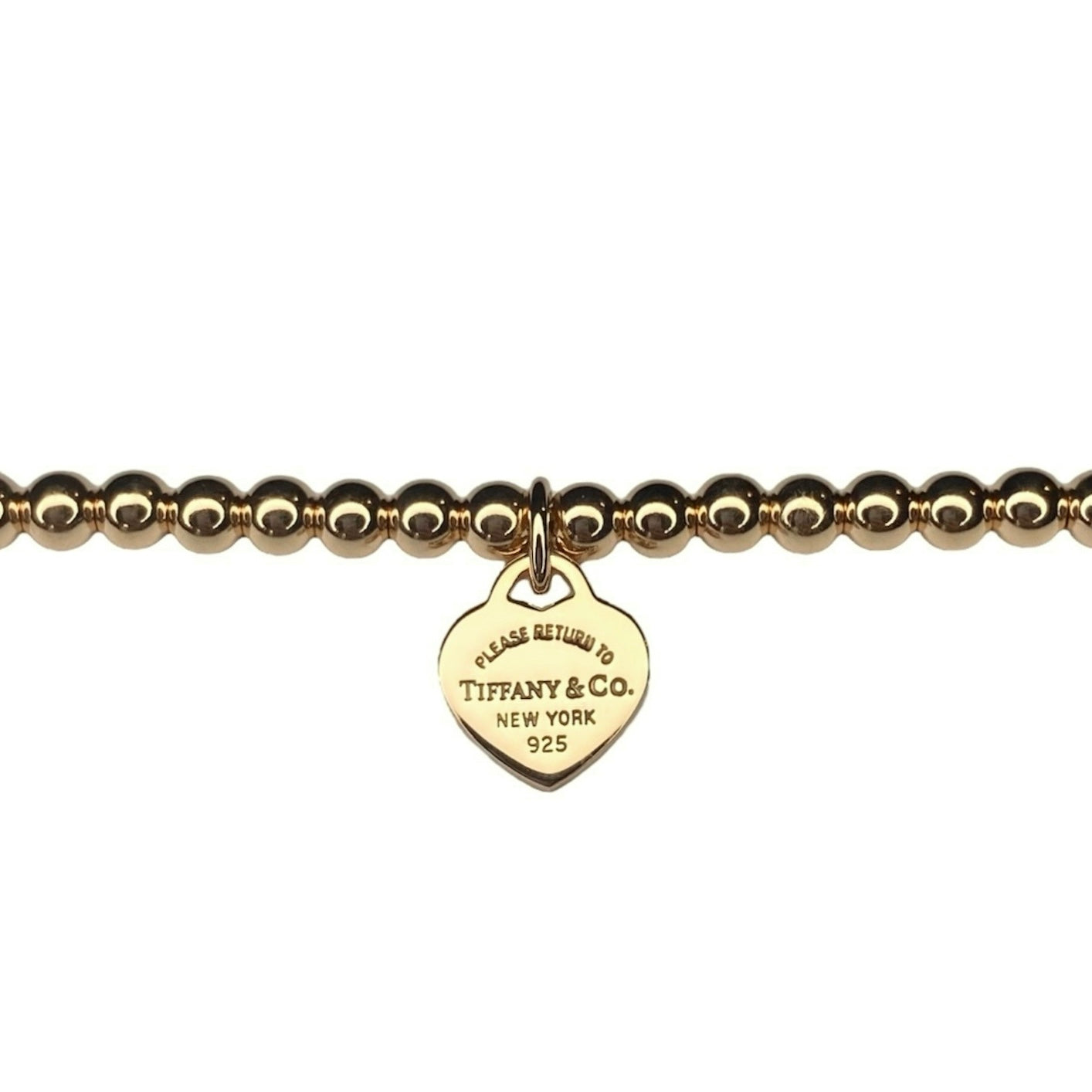 Tiffany & Co. bracelet (Tiffany heart pendant on unbranded ball bracelet) in gold