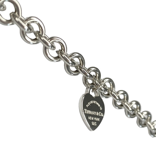 Tiffany & Co. link bracelet with a heart pendant in silver