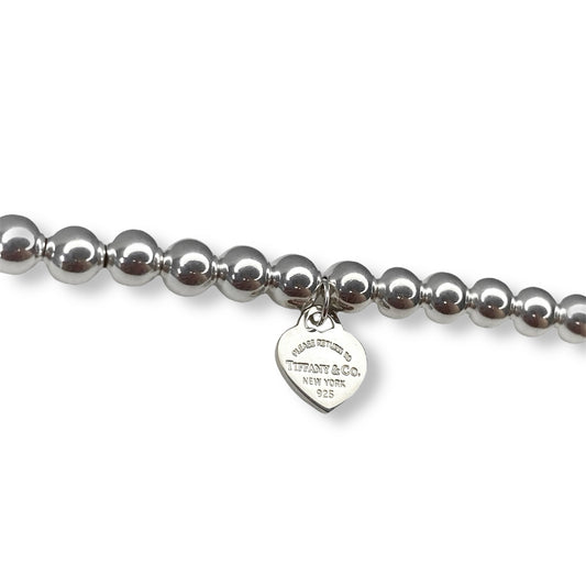 Tiffany & Co. bracelet ( Tiffany heart pendant on unbranded ball bracelet)
