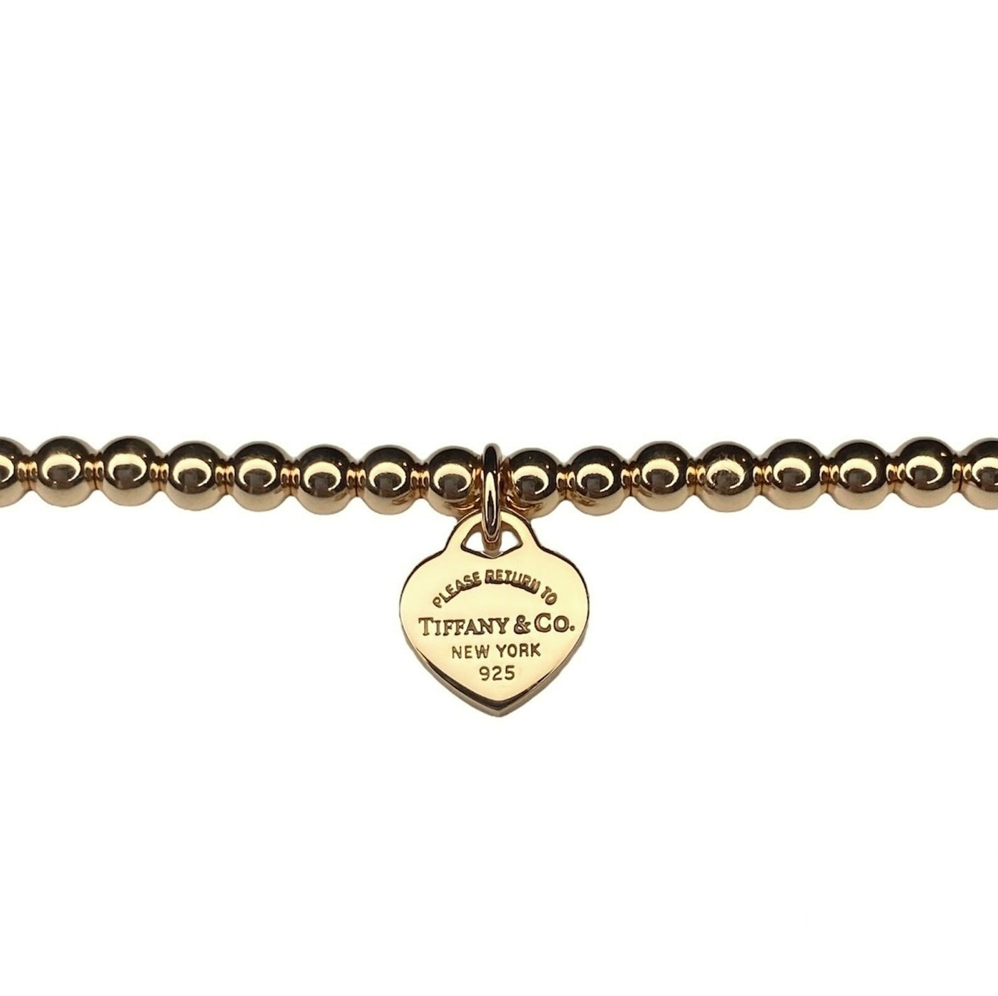 Tiffany & Co. bracelet (Tiffany heart pendant on unbranded ball bracelet) in gold