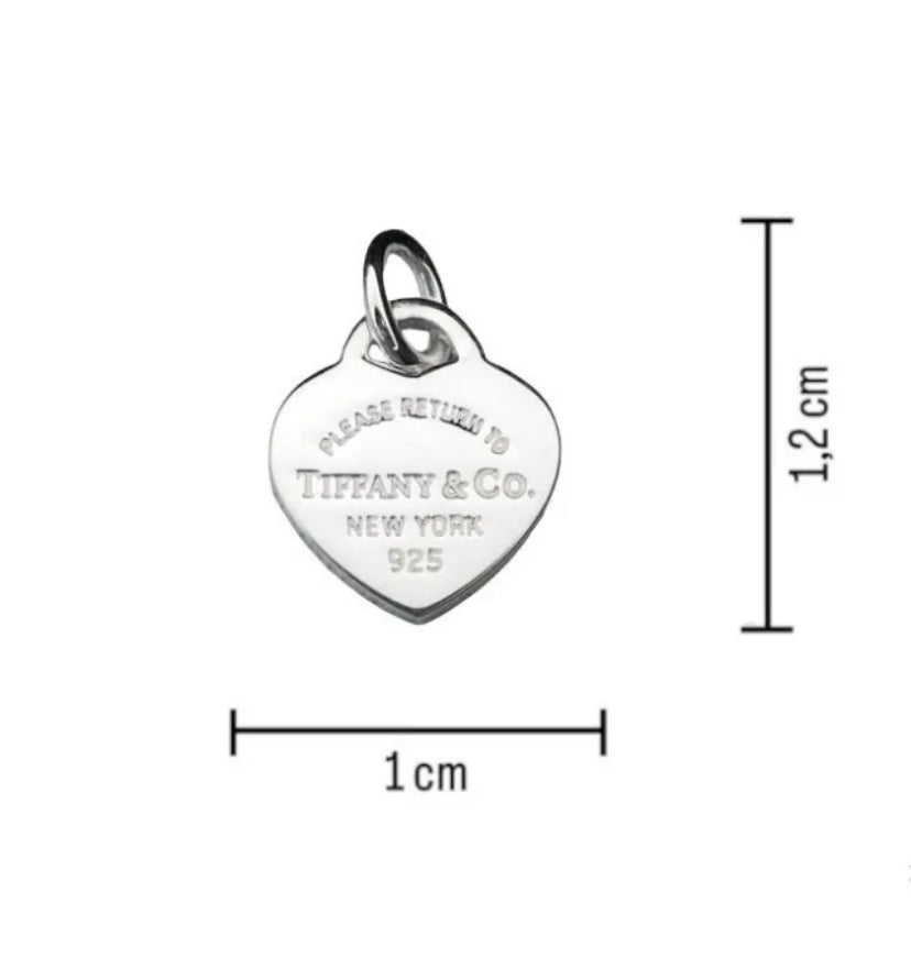 Tiffany & Co. silver heart pendant with a unbranded eyelet