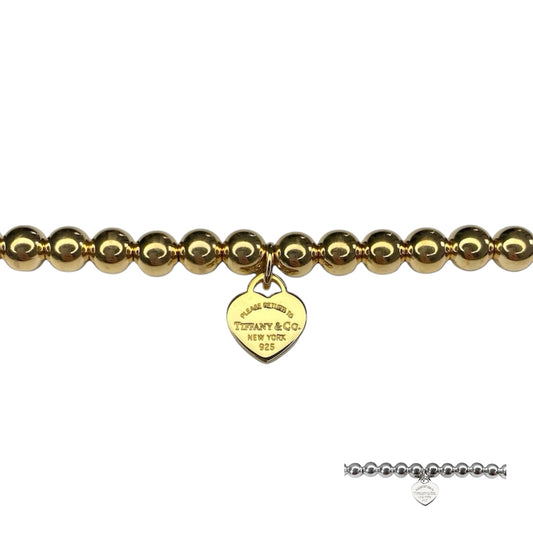 Tiffany & Co. bracelet (Tiffany heart pendant on unbranded ball bracelet) in gold