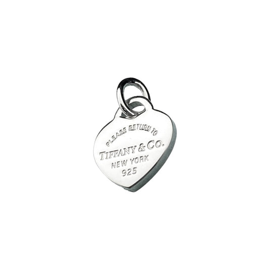 Tiffany & Co. silver heart pendant with a unbranded eyelet