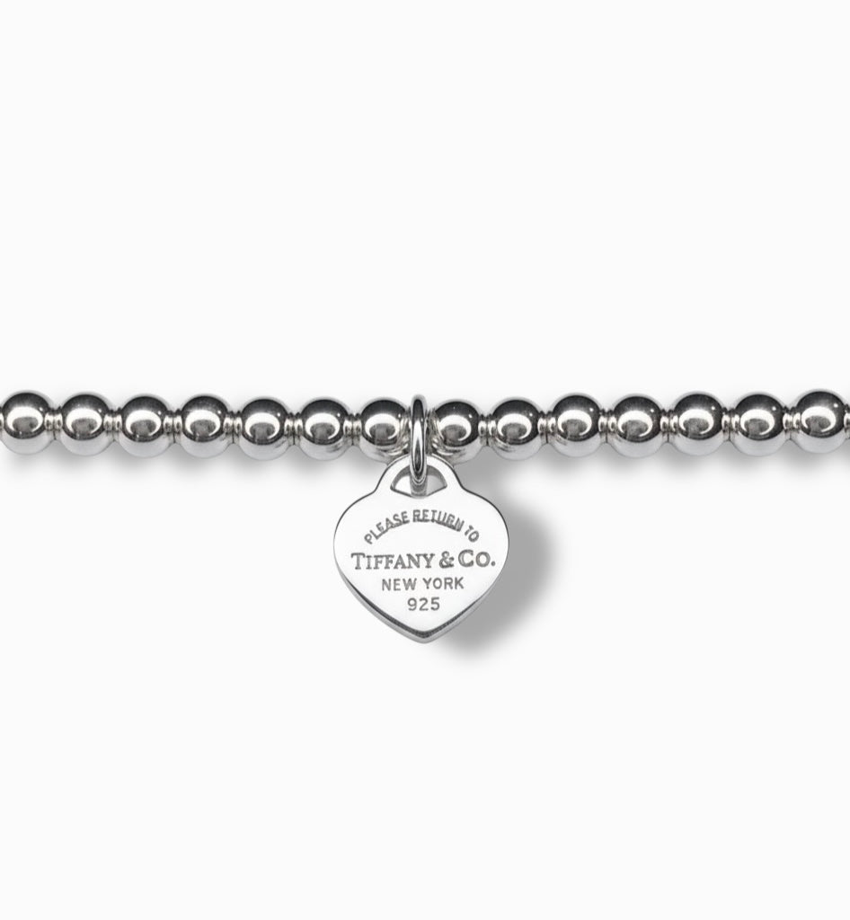 Tiffany & Co. bracelet ( Tiffany heart pendant on unbranded ball bracelet)