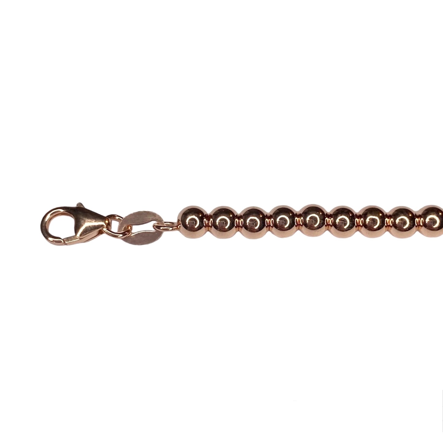 Tiffany & Co. heart pendant on a  unbranded ball bracelet in roségold
