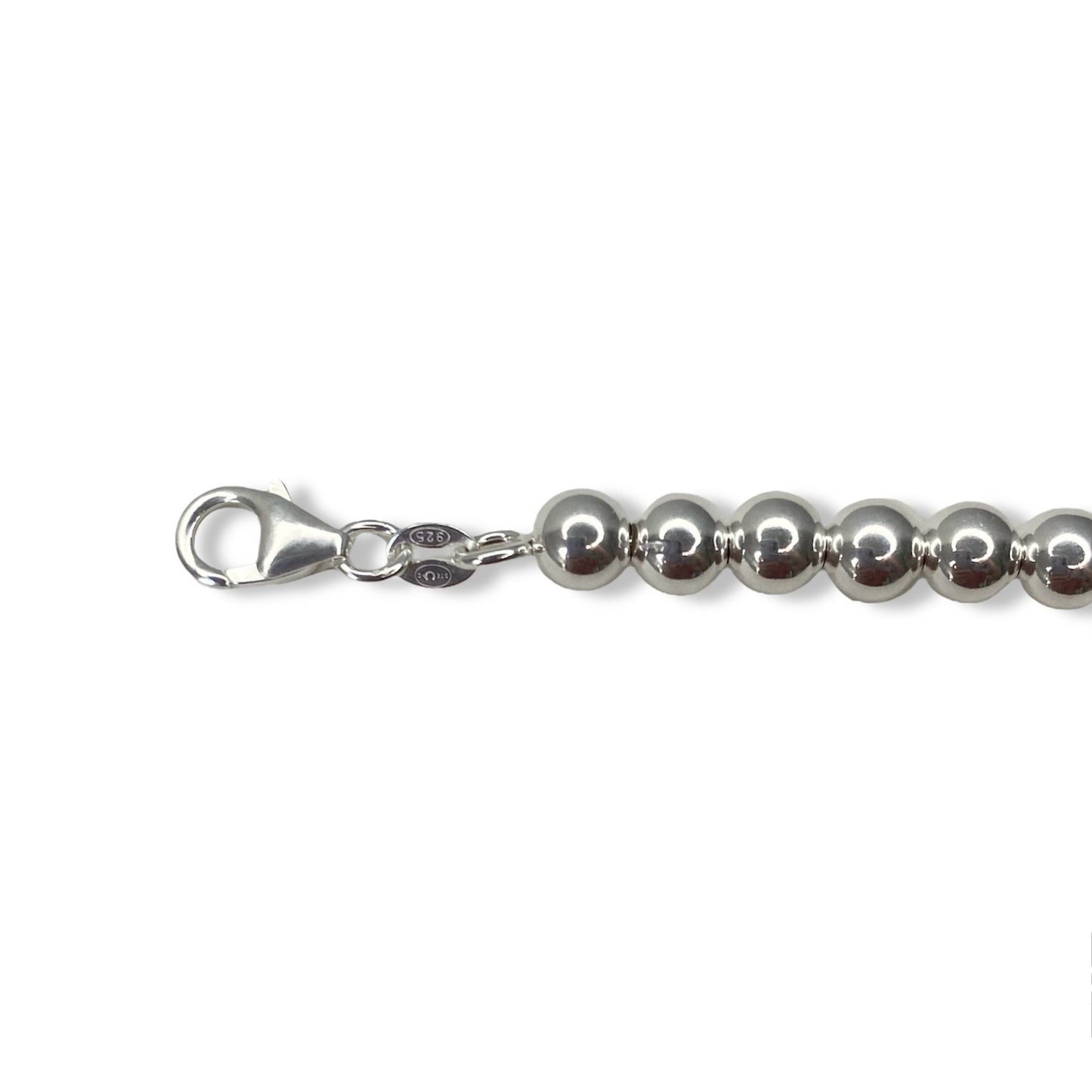Tiffany & Co. bracelet ( Tiffany heart pendant on unbranded ball bracelet)