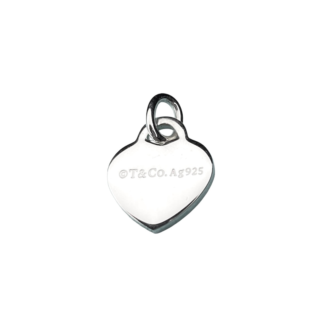 Tiffany & Co. silver heart pendant with a unbranded eyelet