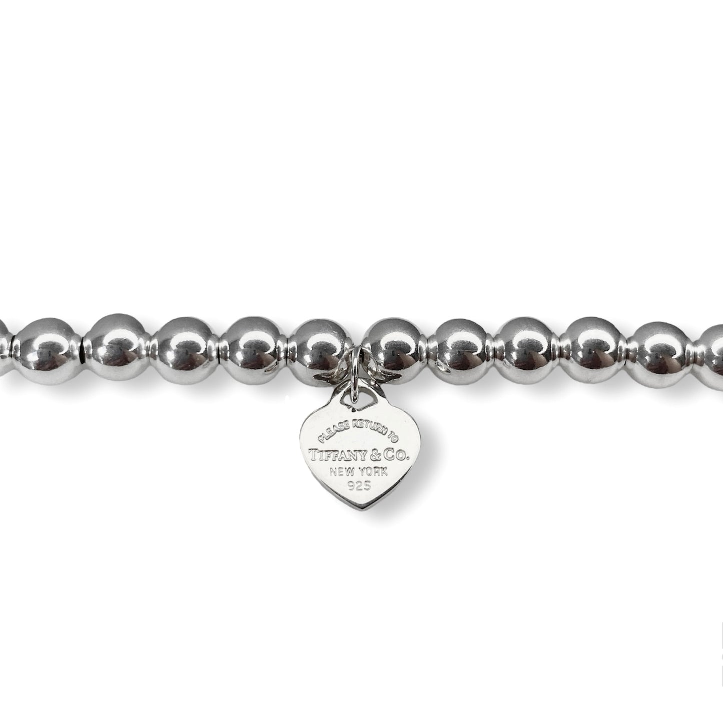 Tiffany & Co. bracelet ( Tiffany heart pendant on unbranded ball bracelet)