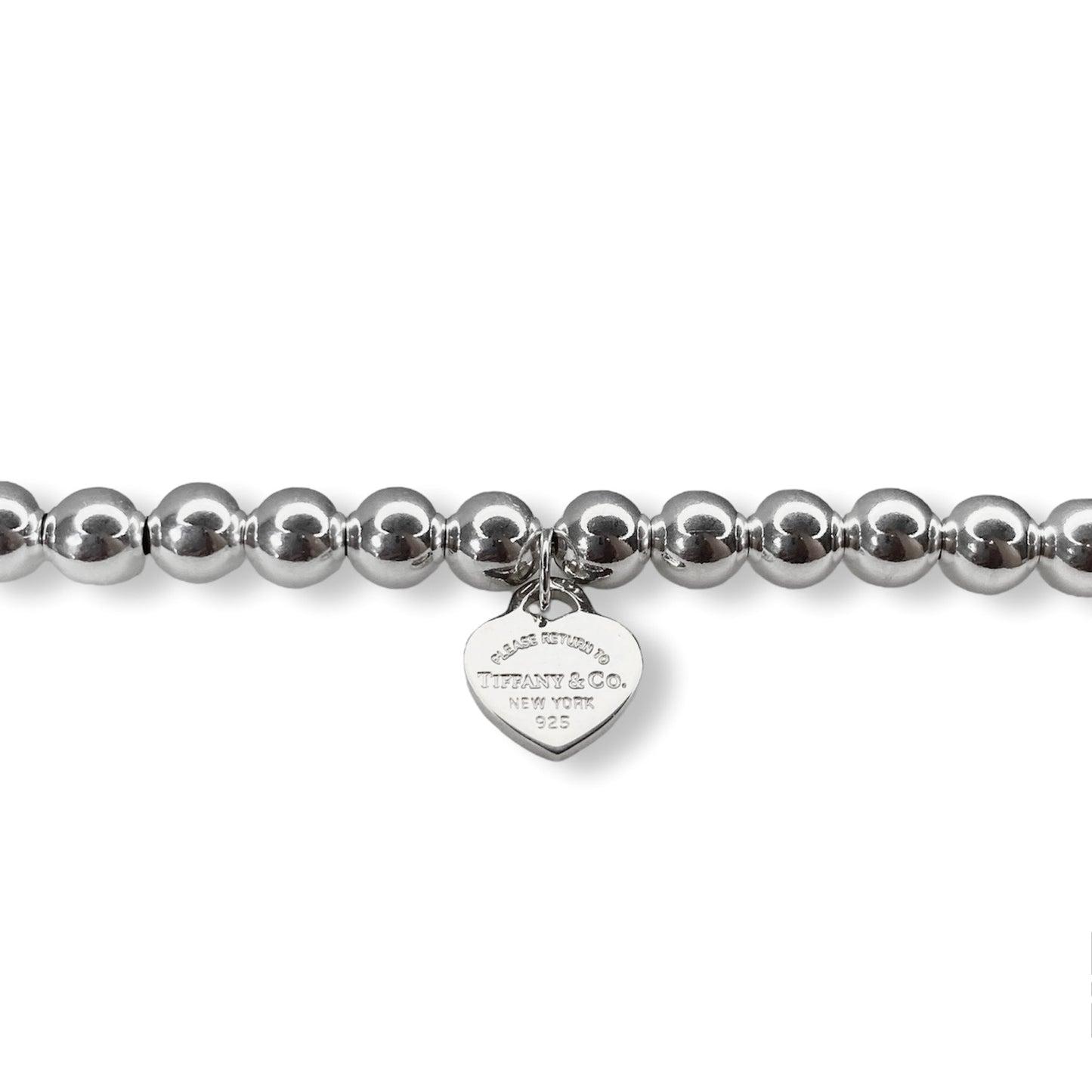 Tiffany & Co. bracelet ( Tiffany heart pendant on unbranded ball bracelet)
