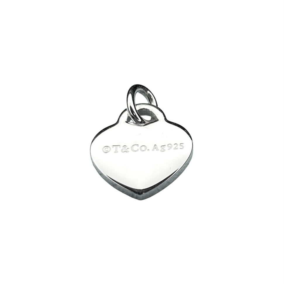 Tiffany & Co. silver heart pendant with a unbranded eyelet