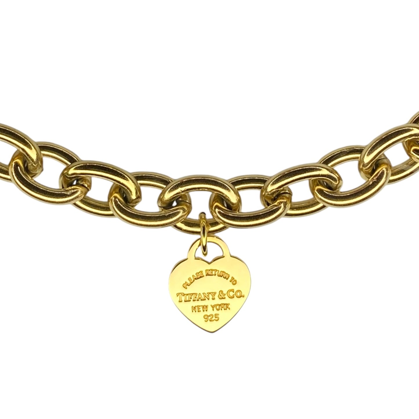 Tiffany & Co. gold heart pendant on an unbranded link bracelet, adjustable